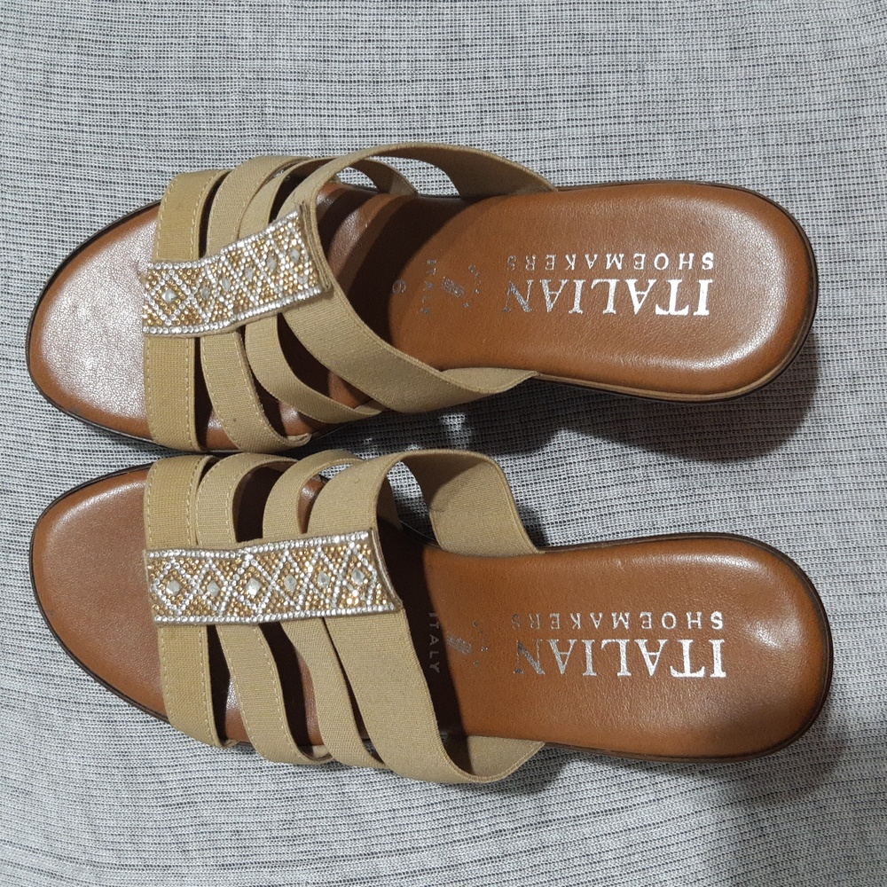 Wedge sandals dark beige with elastic straps and gold&crystal detailing at top.